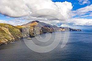 Aerial view of the beautiful coast at Malin Beg with Slieve League in the background in County Donegal, Ireland