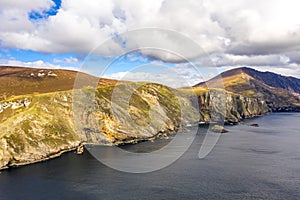 Aerial view of the beautiful coast at Malin Beg with Slieve League in the background in County Donegal, Ireland