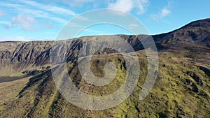 Aerial view of the beautiful coast at Malin Beg with Slieve League in the background in County Donegal, Ireland