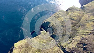 Aerial view of the beautiful coast at Malin Beg with Slieve League in the background in County Donegal, Ireland