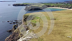 Aerial view of the beautiful coast at Malin Beg with Slieve League in the background in County Donegal - Ireland