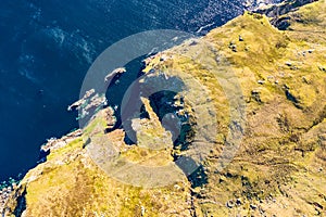 Aerial view of the beautiful coast at Malin Beg with Slieve League in the background in County Donegal, Ireland