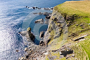 Aerial view of the beautiful coast at Malin Beg with Slieve League in the background in County Donegal, Ireland