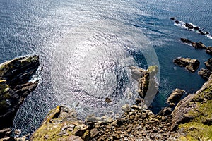 Aerial view of the beautiful coast at Malin Beg with Slieve League in the background in County Donegal, Ireland