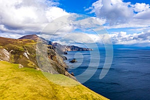 Aerial view of the beautiful coast at Malin Beg with Slieve League in the background in County Donegal, Ireland