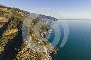 Aerial view of the beautiful coastline at sunset near Vernazza facing the Tyrrhenian Sea, Cinque Terre, Liguria, Italy