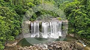 Aerial view of beautiful Curtain Falls in the greenery of Baganga