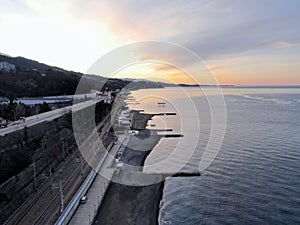 Aerial view beautiful dawn on the sea coast. Panoramic landscape from the height of the sea beach in the rays of the morning sun