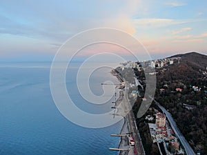 Aerial view beautiful dawn on the sea coast. Panoramic landscape from the height of the sea beach in the rays of the morning sun