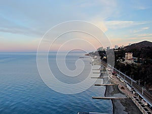 Aerial view beautiful dawn on the sea coast. Panoramic landscape from the height of the sea beach in the rays of the morning sun