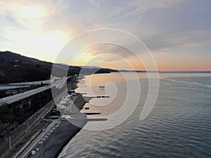 Aerial view beautiful dawn on the sea coast. Panoramic landscape from the height of the sea beach in the rays of the morning sun