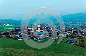 Aerial view of beautiful Ellmau at dusk on a foggy summer evening, a lovely alpine village photo