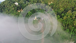 Aerial view of beautiful foggy over Khao Na Nai Luang Dharma Park in Surat Thani, Thailand