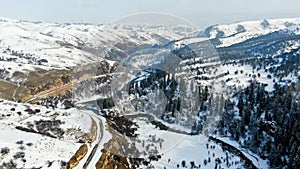 Aerial view of Beautiful forest snow scene in the West Tianshan Mountains in winter