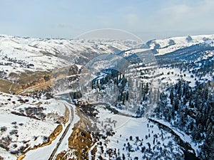 Aerial view of Beautiful forest snow scene in the West Tianshan Mountains in winter