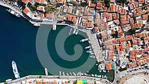 Aerial view of the beautiful Greek island of Symi (Simi) with colourful houses and small boats. Greece, Symi island, view of the