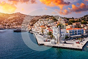 Aerial view of the beautiful greek island of Symi (Simi) with colourful houses and small boats.