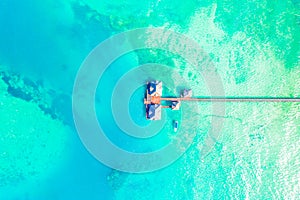 Aerial view of beautiful hotel in Indian ocean at sunset in summer. Zanzibar, Africa. Top view. Landscape with wooden hotel on the