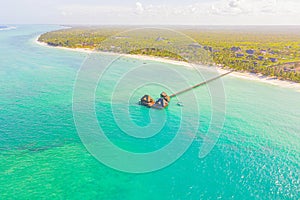 Aerial view of beautiful hotel in Indian ocean at sunset in summer. Zanzibar, Africa. Top view. Landscape with wooden hotel on the