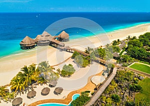 Aerial view of beautiful hotel on the sea. Sandy beach