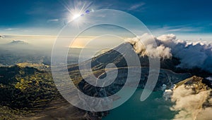 Aerial view of beautiful Ijen volcano with acid lake and sulfur gas going from crater