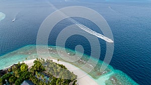 Aerial view of beautiful island at Maldives in the Indian Ocean. Top view from drone