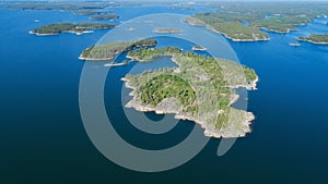 Aerial view of beautiful islands with green trees and rocks on the baltic sea photo