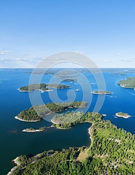 Aerial view of beautiful islands with green trees and rocks on the baltic sea at sunny summer day photo