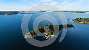 Aerial view of beautiful islands with green trees and rocks on the baltic sea at sunset in summer. photo