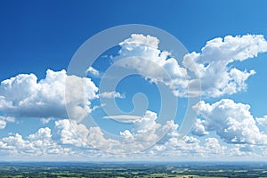 aerial view of beautiful landscape with blue sky, white cumulus clouds and plain with fields and trees for abstract