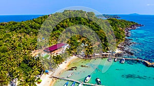 Aerial view of beautiful landscape, tourism boats, and people swimming on the sea and beach on May Rut island (a tranquil island