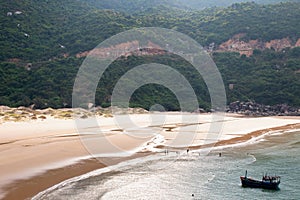 Aerial view of beautiful landscape, tourism boats, and people swimming on the sea, Vietnam. Travel concept