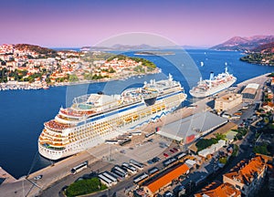 Aerial view of beautiful large white cruise ships at sunset