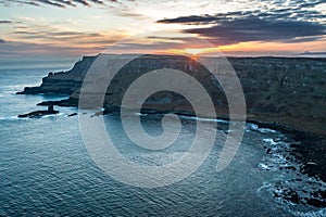 Aerial view on a beautiful morning with sunrise at Giants Causeway, the famous landmark in Northern Ireland UK