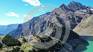 Aerial view of beautiful mountains and a lake in Seriana Valley in Italy