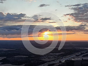 Aerial view is a beautiful panorama of the morning landscape of clouds in the rays of the rising sun. Dawn of the sun