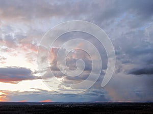 Aerial view a beautiful panoramic landscape of clouds at sunset. A picture of clouds in the rays of the setting sun