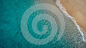 Aerial view of beautiful sandy beach and soft turquoise ocean wave. Tropical sea in summer season on Egremni beach on Lefkada