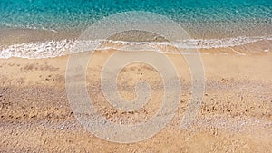 Aerial view of beautiful sandy beach and soft turquoise ocean wave. Tropical sea in summer season on Egremni beach on Lefkada