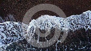 Aerial view beautiful sea waves slowly spread across the beach