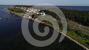Aerial view of beautiful seaside town and scenic coast road by the sea. Seaside road and promontory