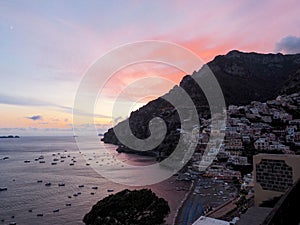 Aerial view of the beautiful shore of Positano on the Amalfi Coast in Italy at sunset