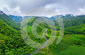Aerial view of Beautiful sky road over top of mountains with green jungle in Nan province, Thailand