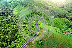 Aerial view of Beautiful sky road over top of mountains with green jungle in Nan province, Thailand