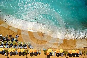 Aerial View of Beautiful Summer Beach with People, Blue Sea and Umbrellas. Travel and Vacation Concept.