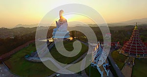 Aerial view beautiful sunset The white big Guanyin statue the biggest in the world at Wat Huay Pla Kang.