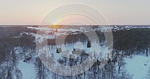 Aerial view of beautiful sunset at winter forest.