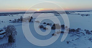 Aerial view of beautiful sunset at winter forest.