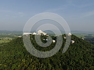 An aerial view of Beautiful Temple on the mountain stands prominently at Wat Nong Hoi in Ratchaburi near the Bangkok, Thailand.