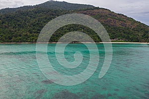 Aerial view of beautiful tropical beach with crystal clear lagoon sea